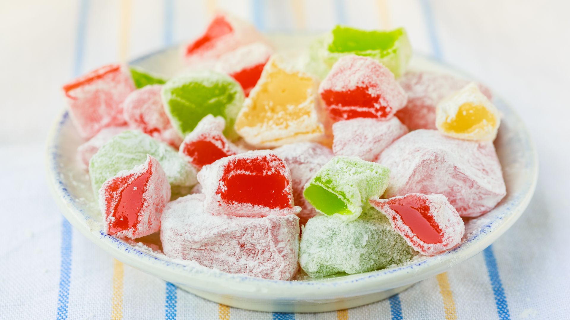 Traditional confection made from starch and sugar, often flavored with rosewater, lemon, or other ingredients and dusted with powdered sugar.