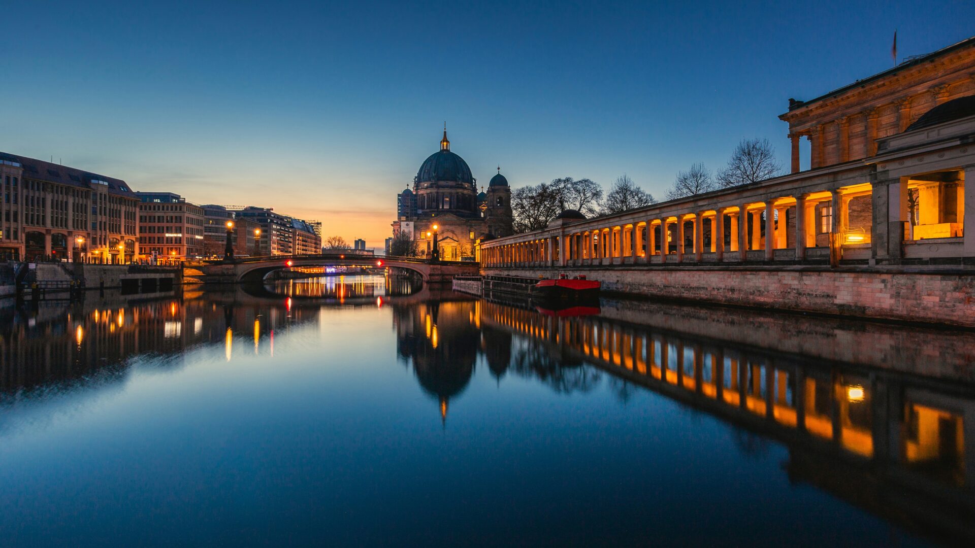 Museum Island illuminated at night with reflections in the river