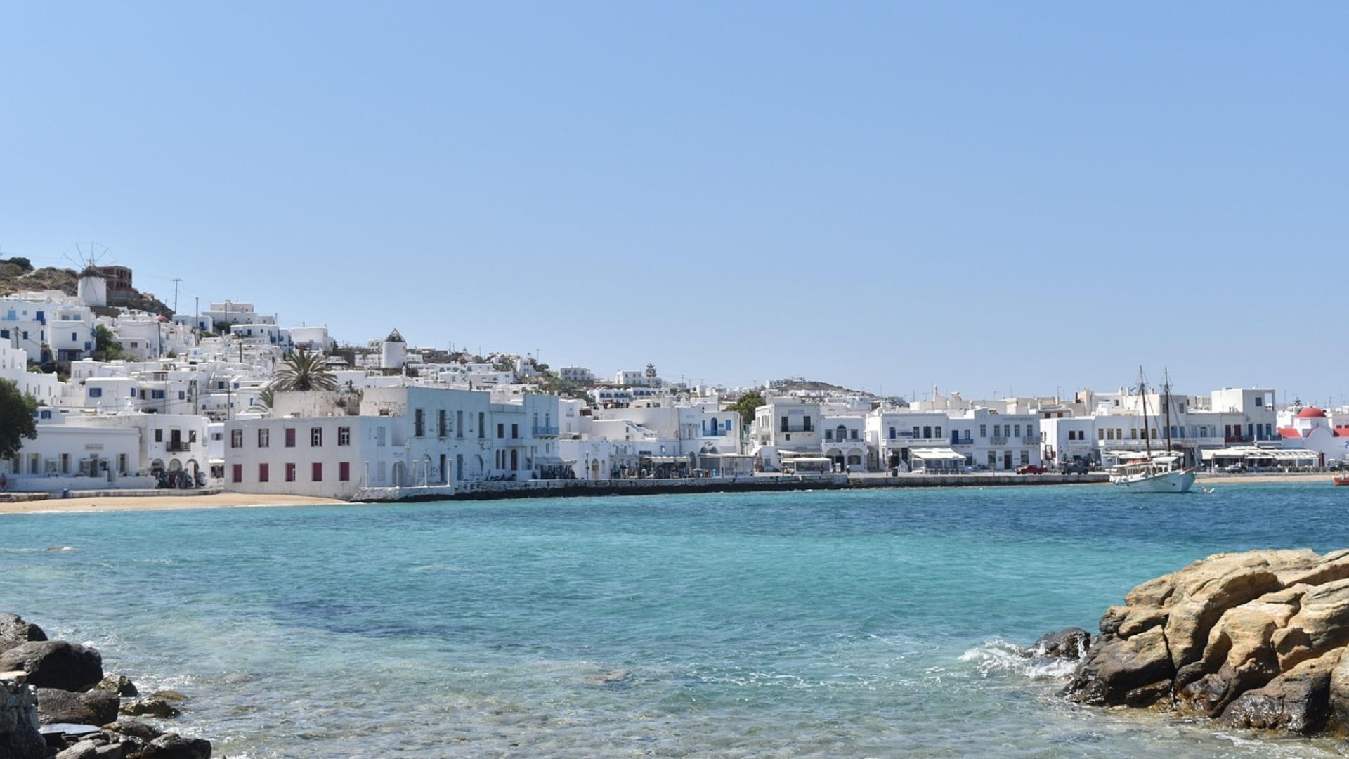 white wash building and clear blue waters at Mykonos Town in Cyclade Island, Greecce.