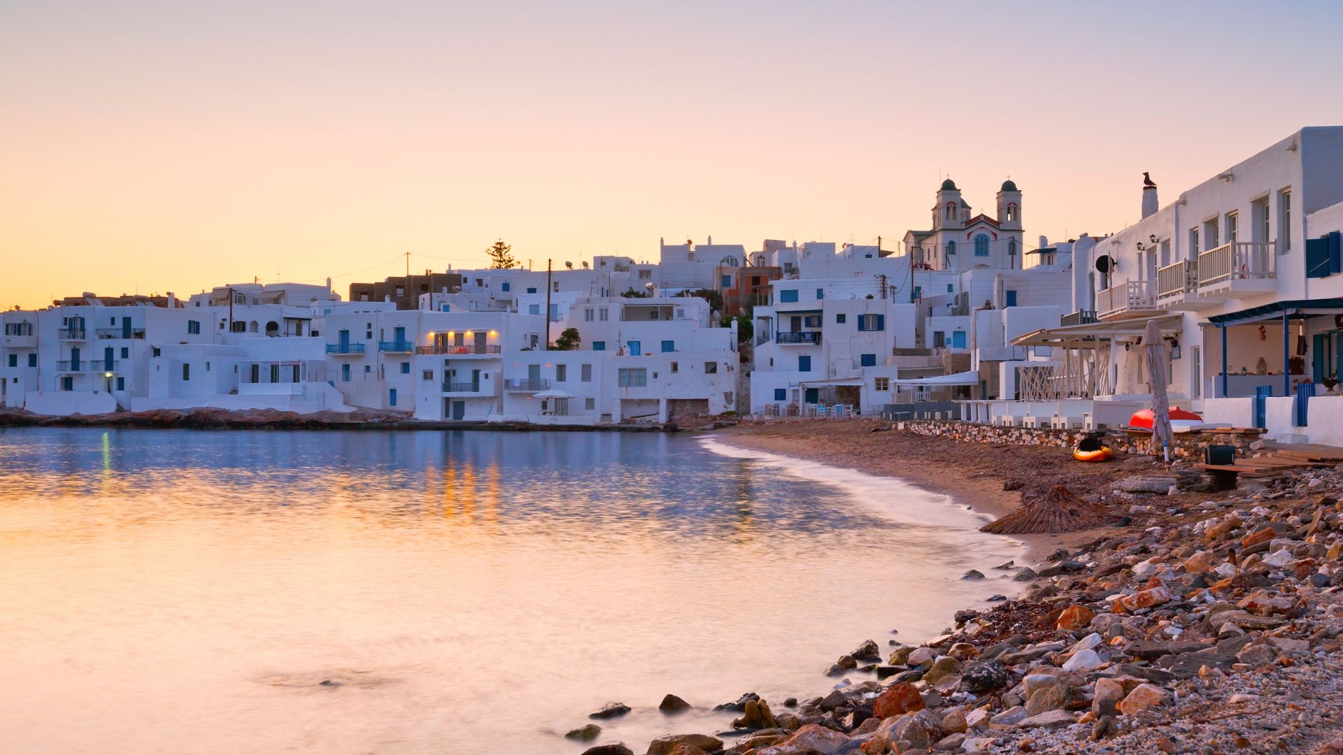 Naoussa harbor in Paros, Greece at sunset.