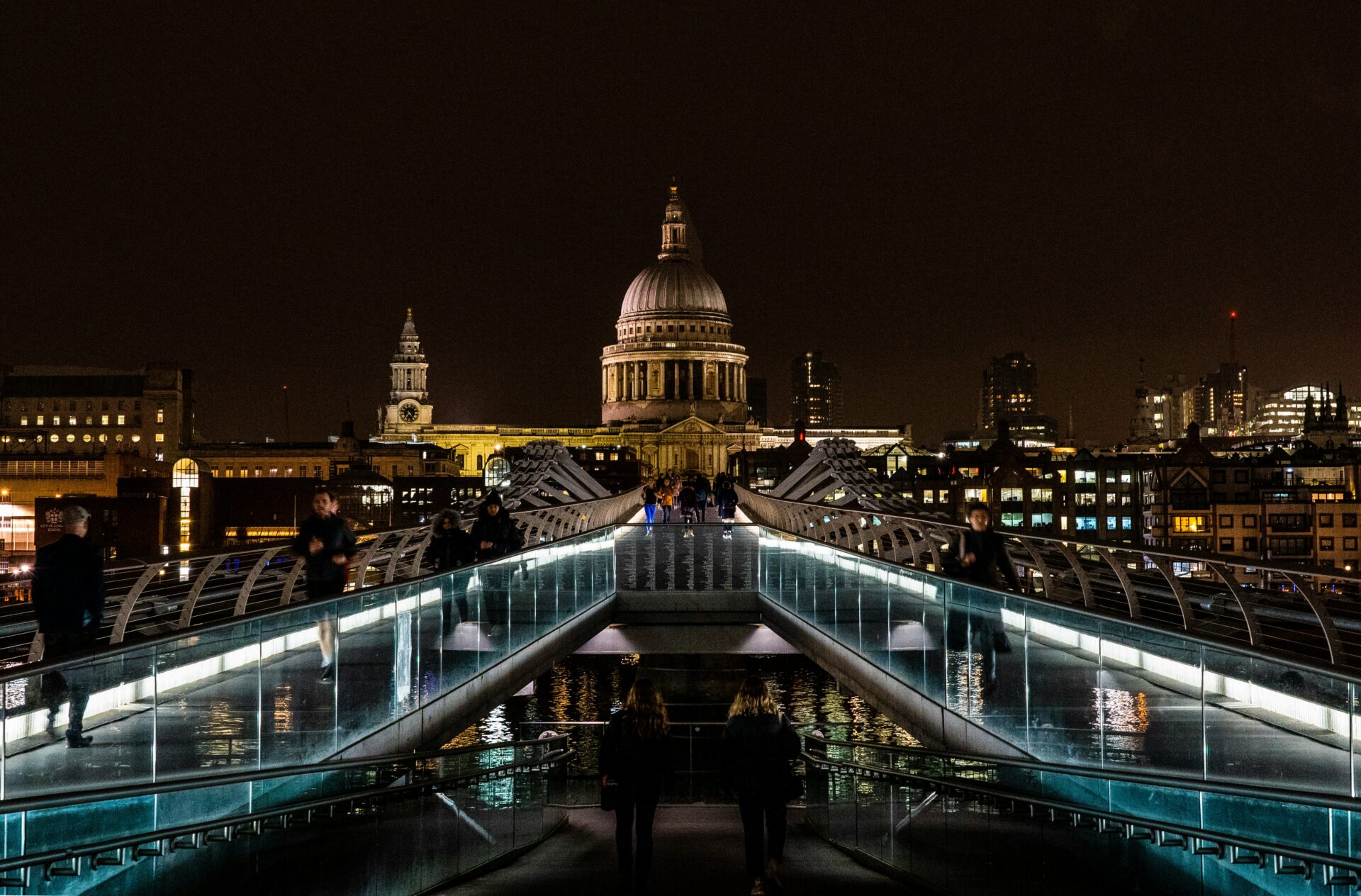 Night view of St. Paul’s Cathedral with lit bridge and vivid sky