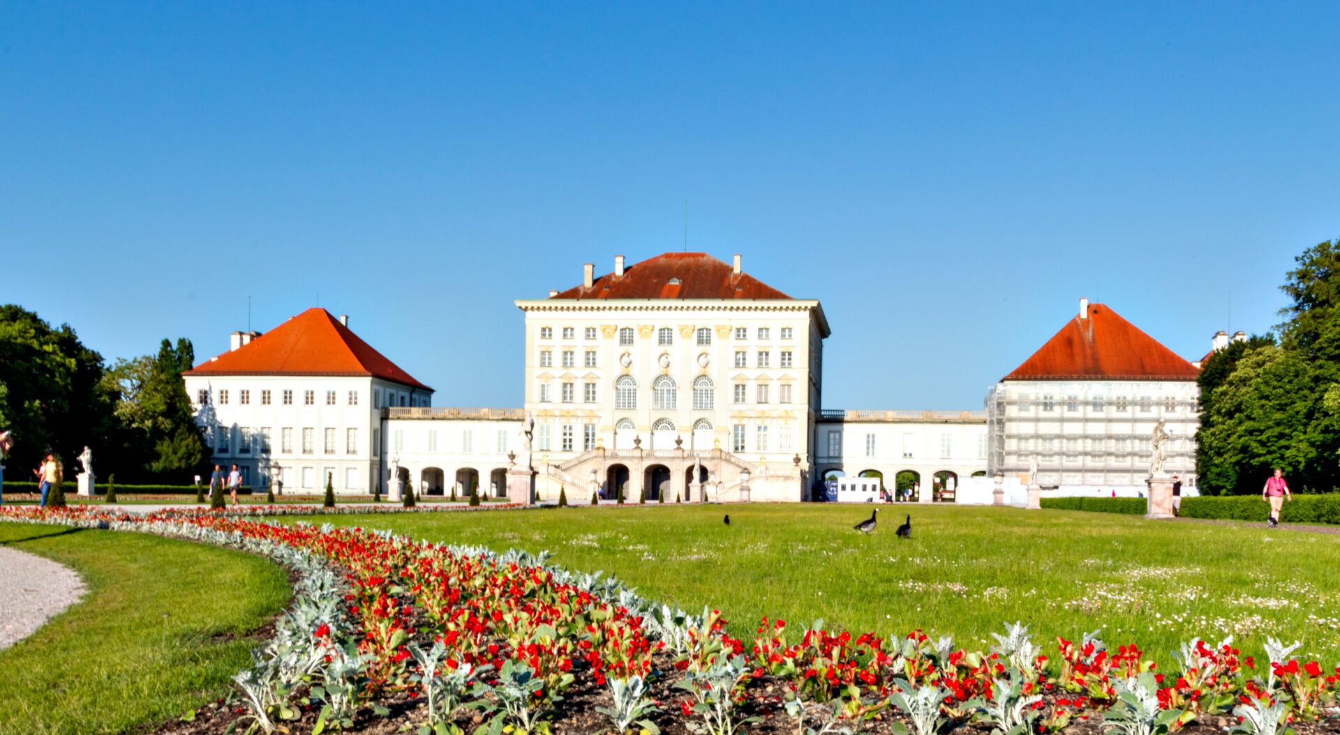 Baroque Nymphenburg Palace with visitors admiring the architecture and gardens
