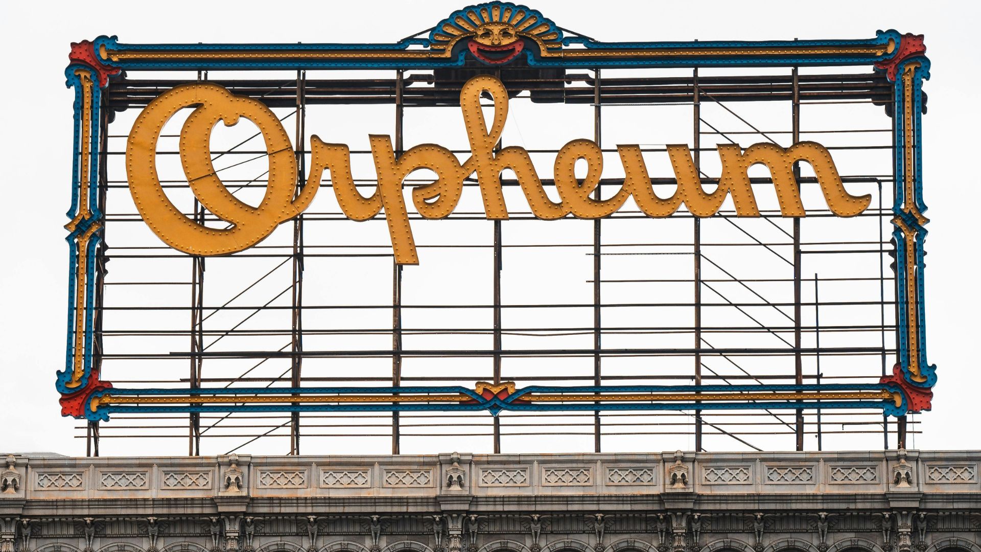 Historic Orpheum Theatre sign and facade in downtown Los Angeles, California, featuring ornate architecture and the illuminated 'Orpheum' marquee, ideal for vaudeville, concerts, and film screenings.