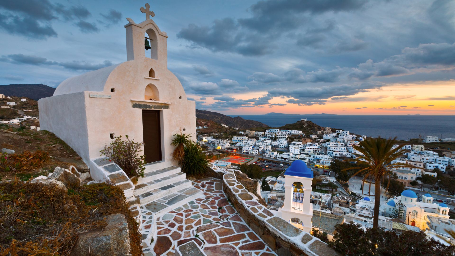 Chora village, Ios Island, Greece, with steps leading to a church.
