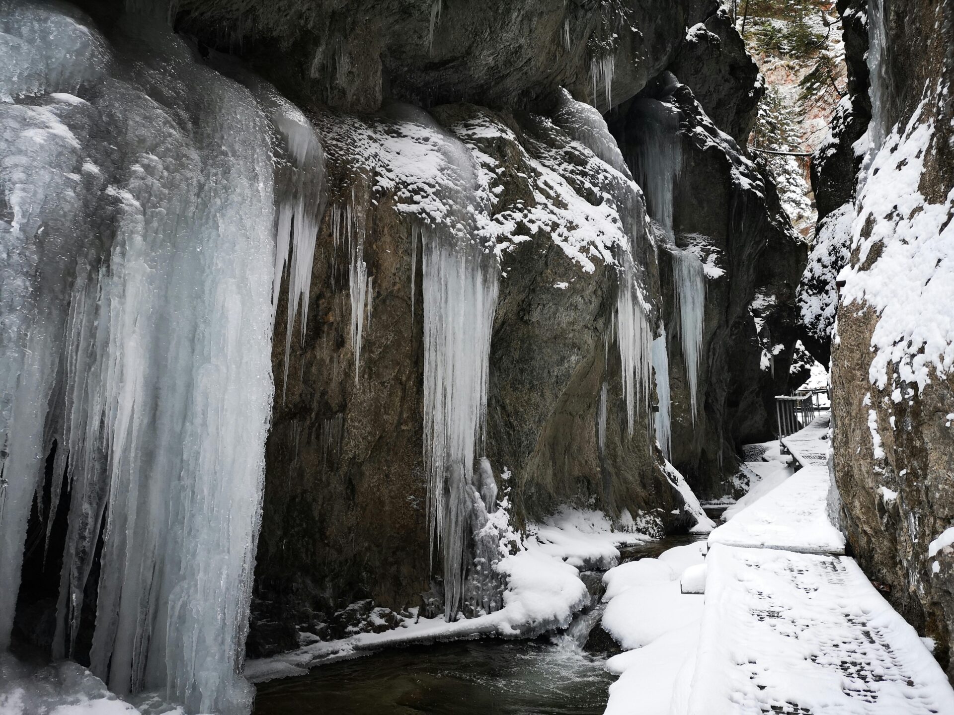 Icy Partnach Gorge in winter with frozen waterfalls