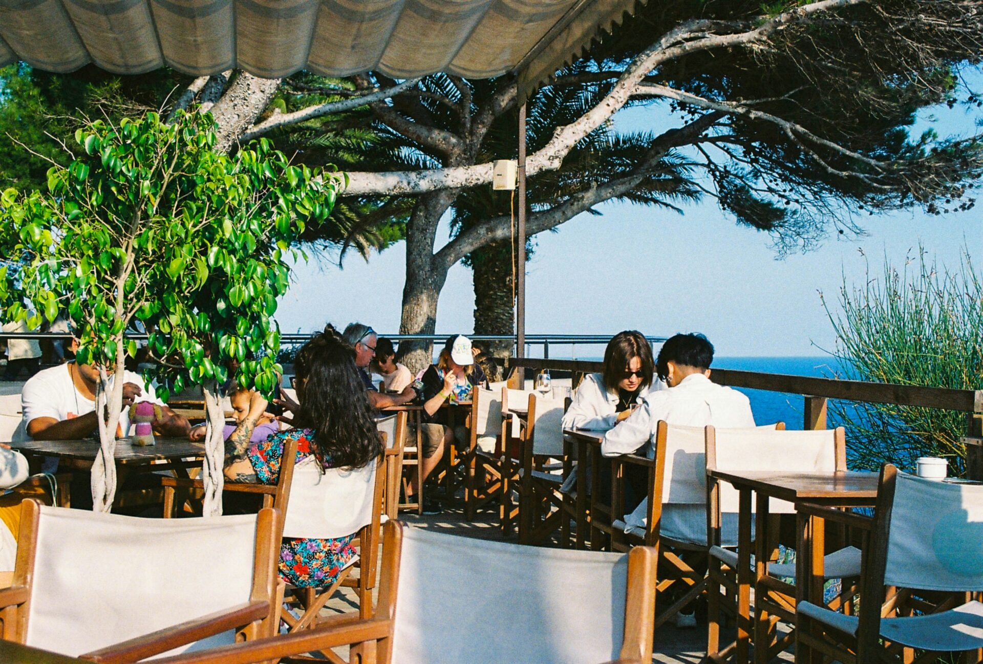 People at the cafe near the beach
