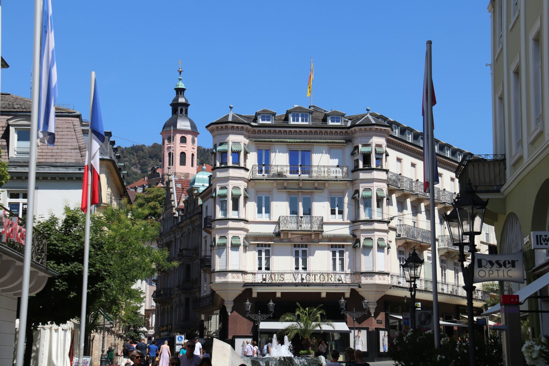 People walking along a charming cobblestone street in Baden-Baden