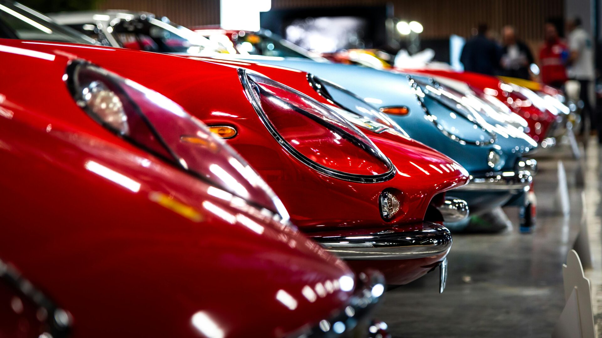 Inside the Porsche Museum: a timeline of iconic cars presented along curved walkways and exhibit platforms.