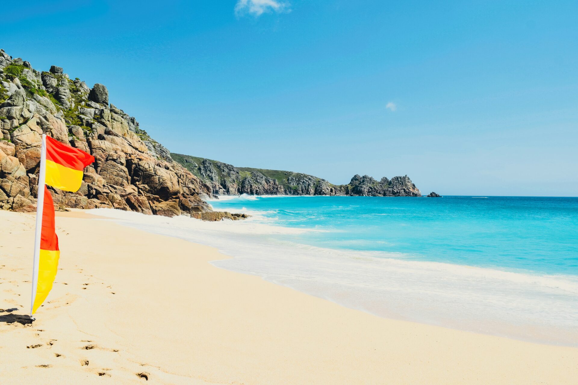Calm turquoise waters of Porthcurno Beach