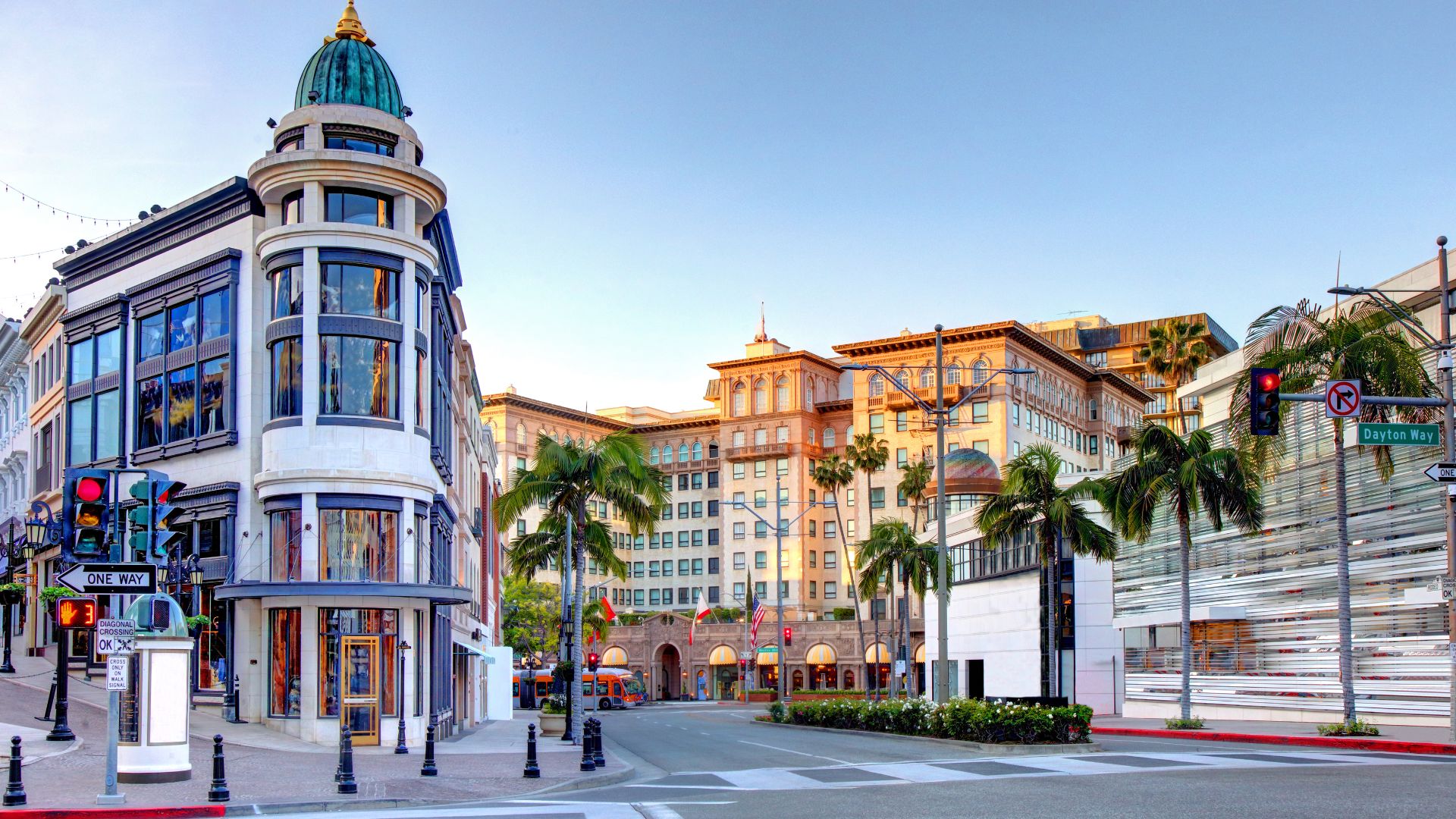 Rodeo Drive, Beverly Hills, California. A luxury shopping district featuring high-end boutiques, palm trees, and unique architecture.