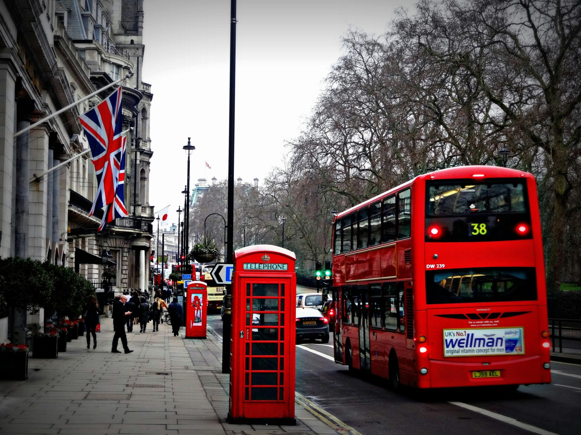 A double-decker bus traveling down a London street