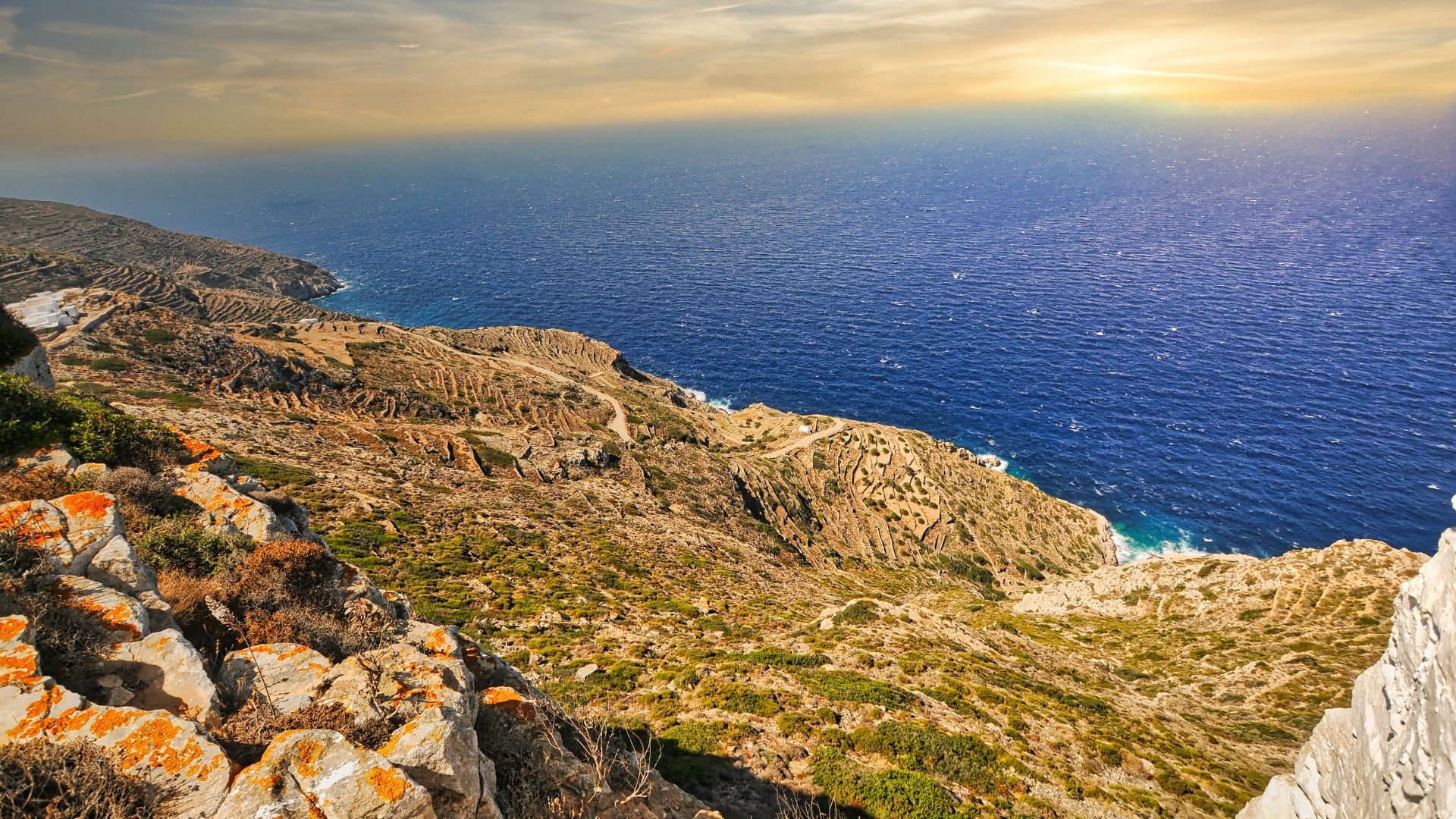 Rugged cliffs and Aegean Sea on the Greek island of Sikinos