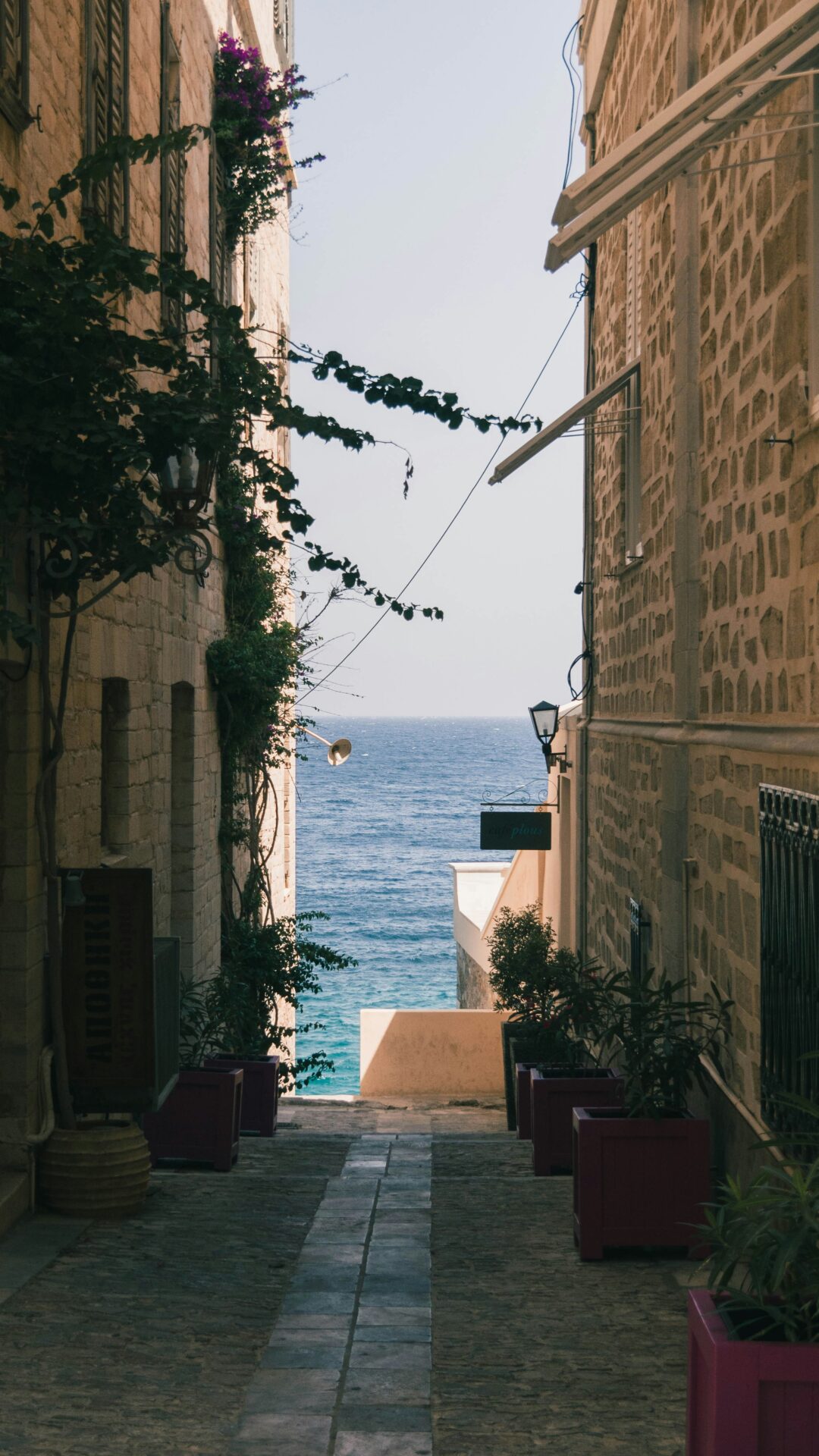 Small alley in Athens with sea view