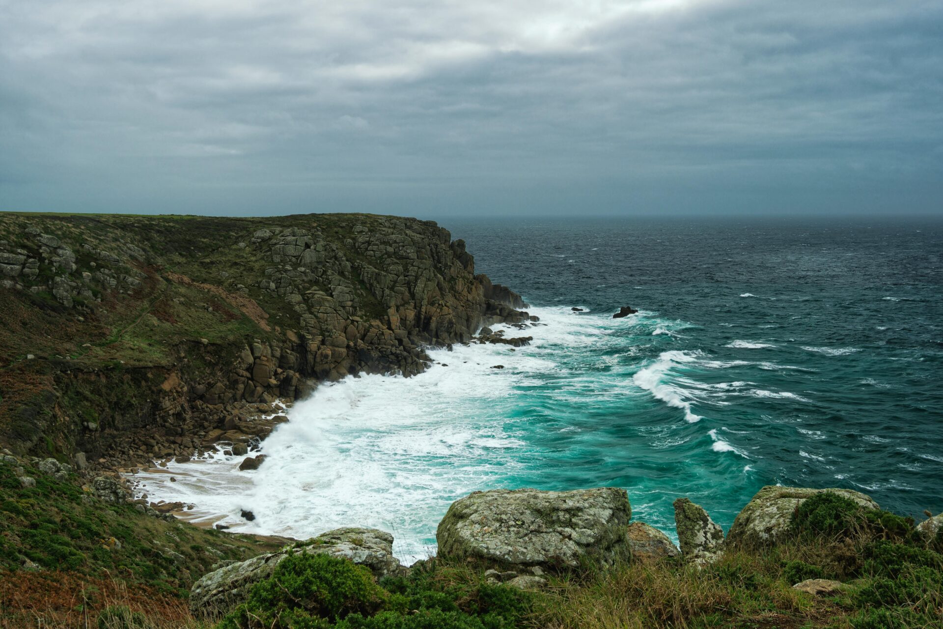Land's End, with jagged cliffs and the expansive Atlantic Ocean beyond.