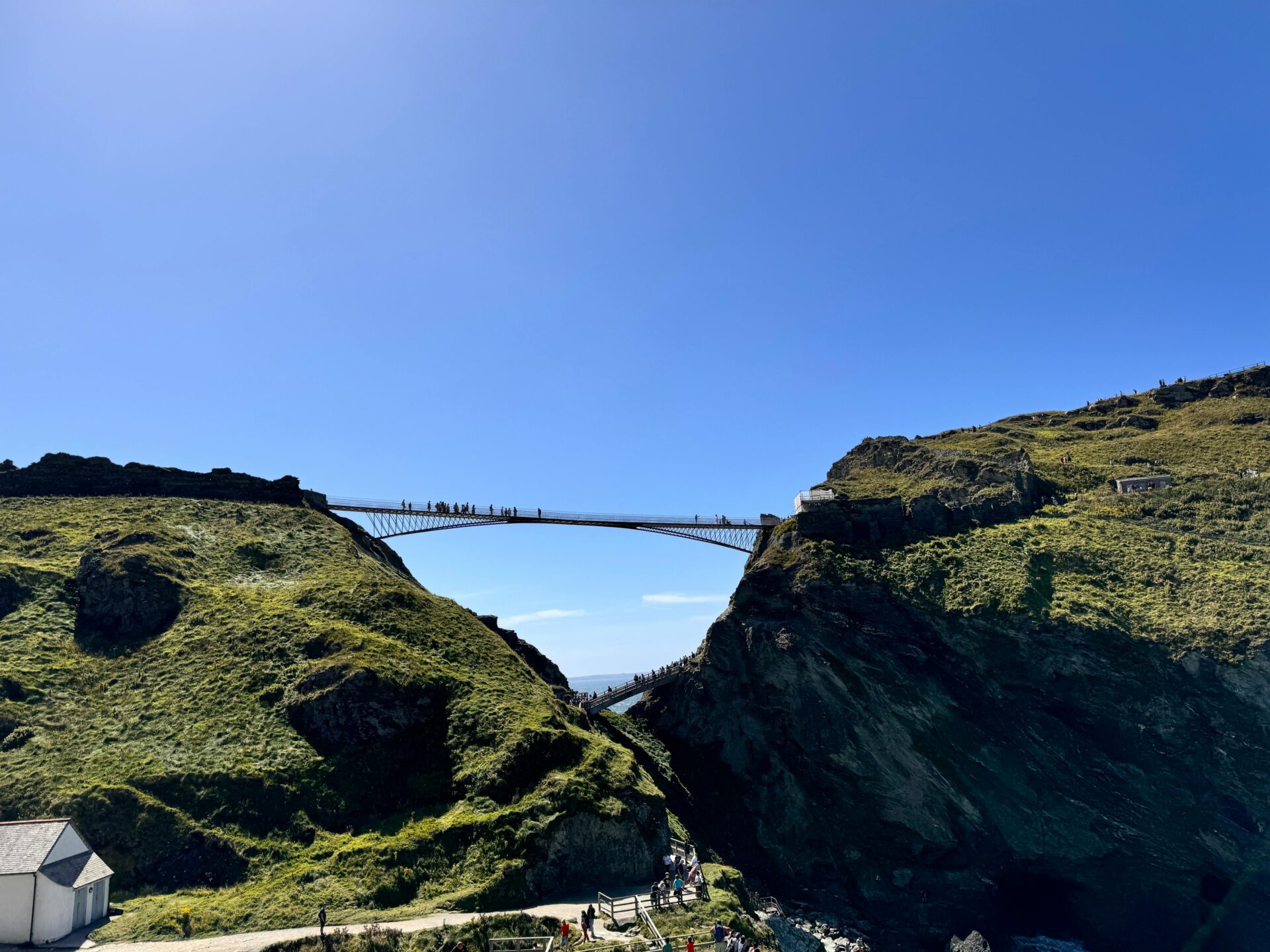 Hanging bridge bridging the gap between Tintagel Castle’s island ruins and the coastal mainland.