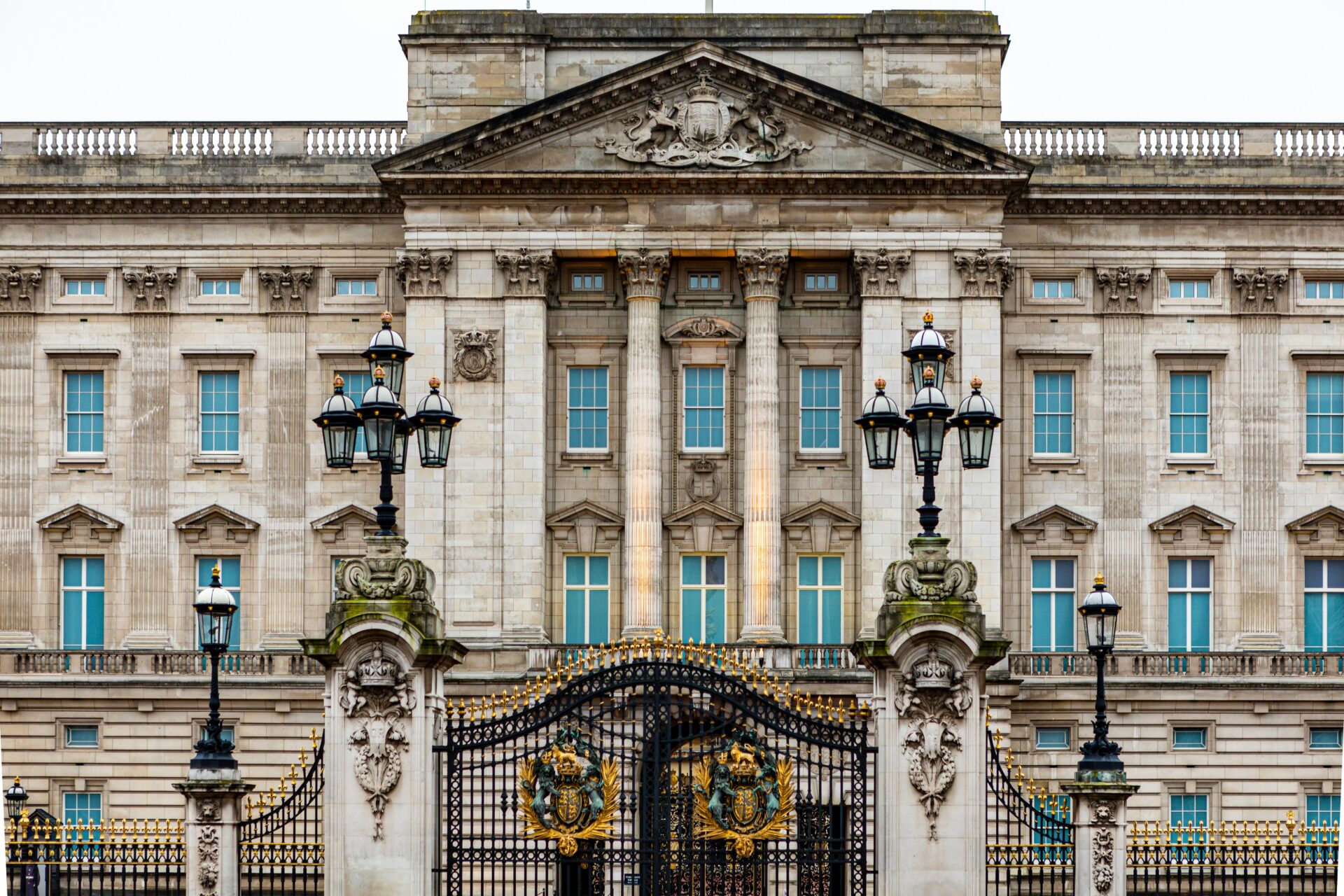 Front view of Buckingham Palace with its grand façade and ornate details.