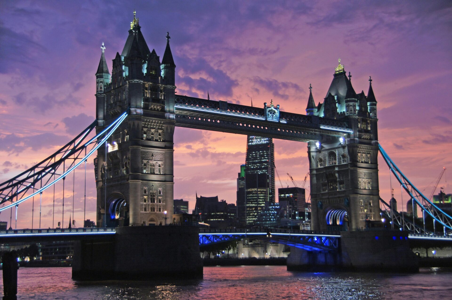 Tower Bridge at sunset with the sky glowing pink and orange