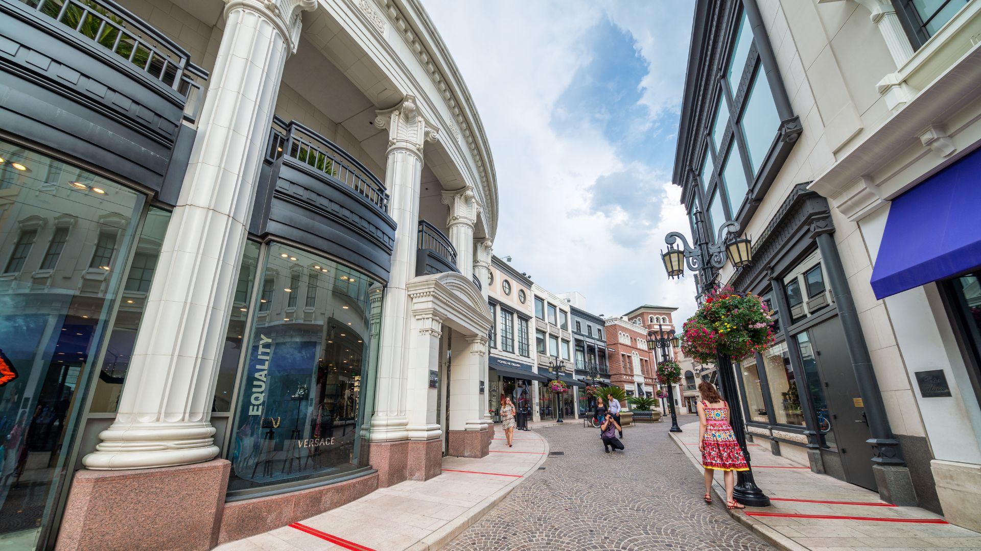 Exterior view of Two Rodeo Drive in Beverly Hills, California, showcasing luxury boutiques and a pedestrian-friendly street with upscale architecture.