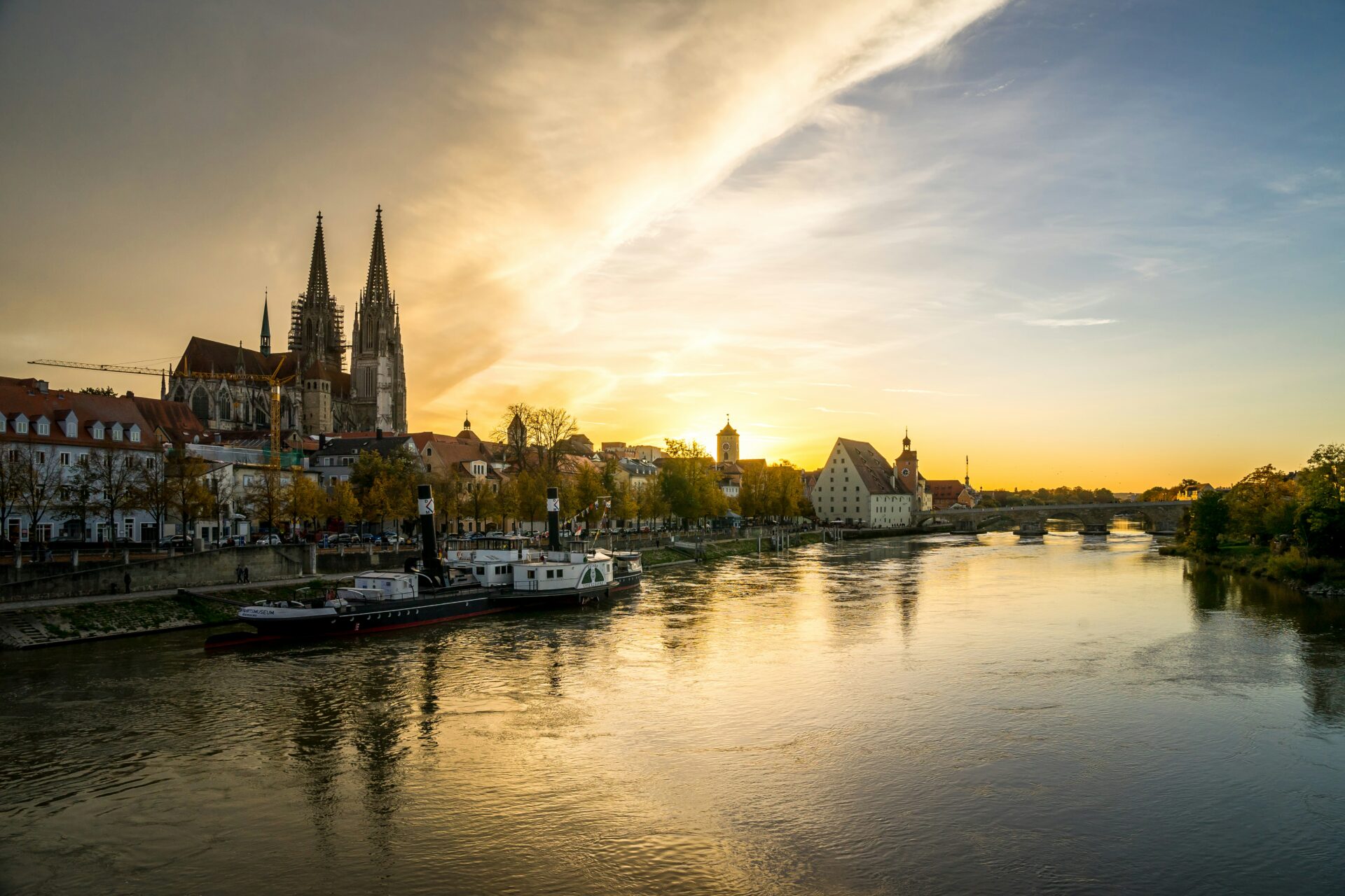 Ulm Minster reflected in the Danube at sunset