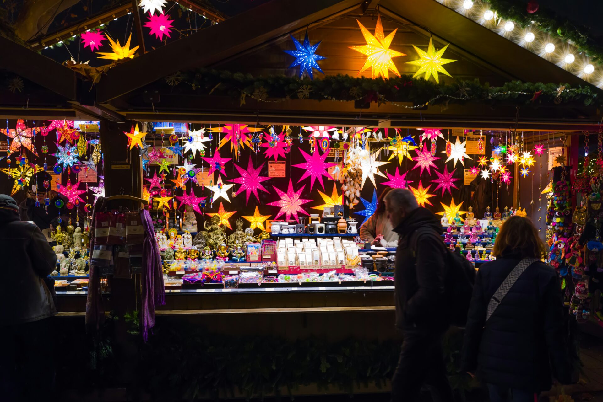 Visitors browsing artisanal goods and handmade holiday items at Stuttgart Christmas Market