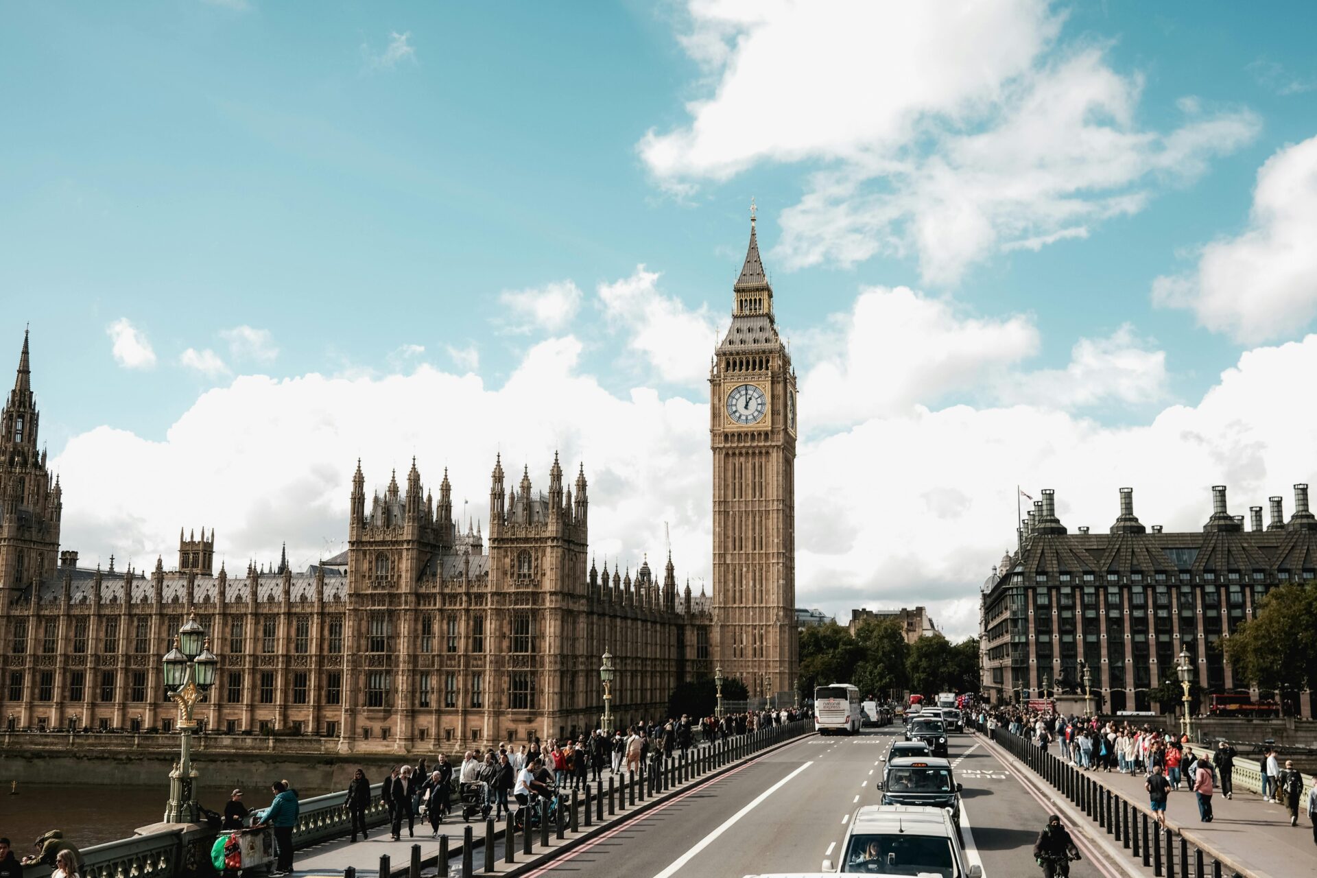 Expansive shot of the Palace of Westminster featuring ornate Gothic architecture.