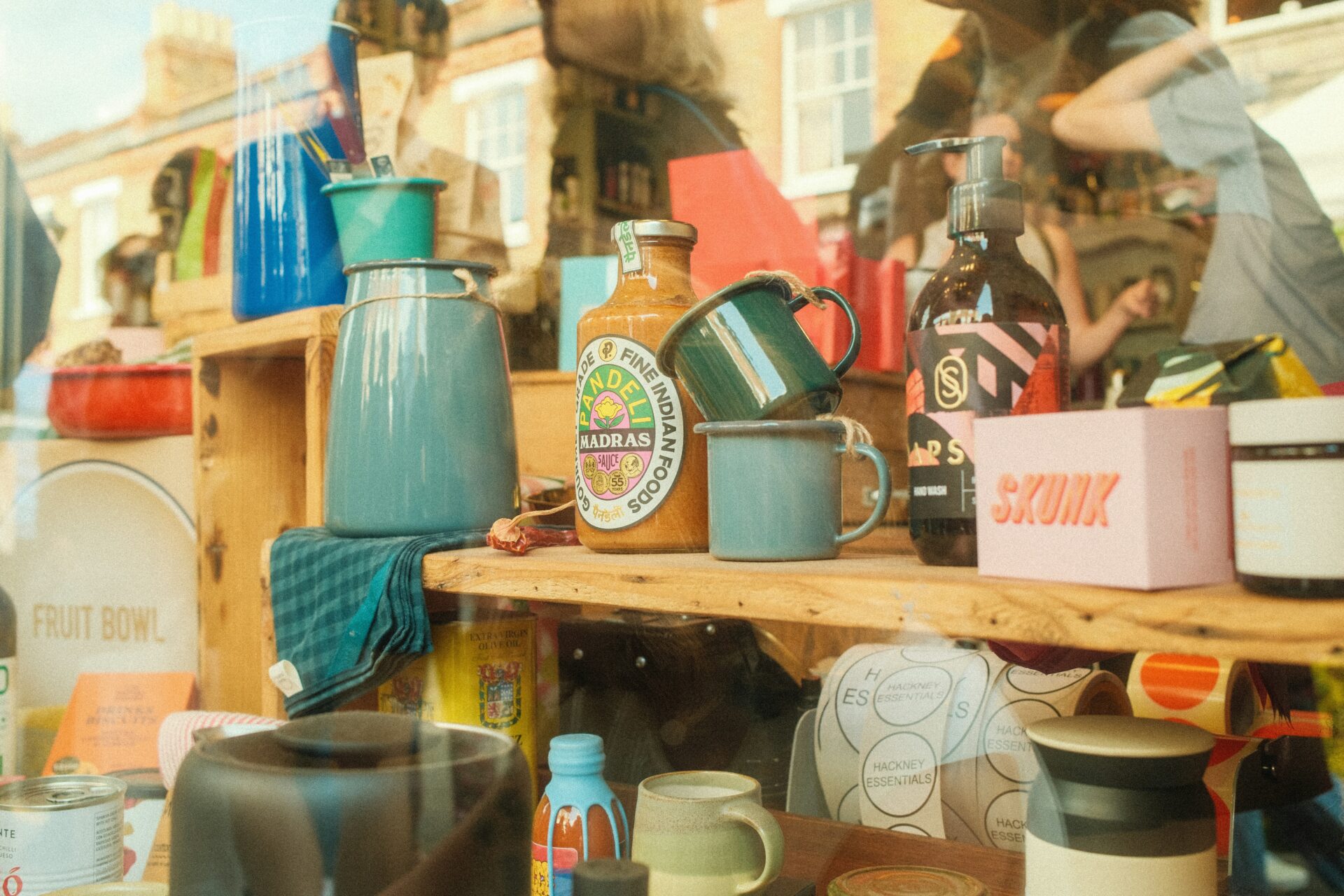 Window display featuring handmade coffee cups and ceramics at Columbia Road Flower Market