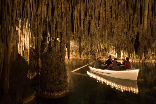 illuminated rowing boat in Drach caves