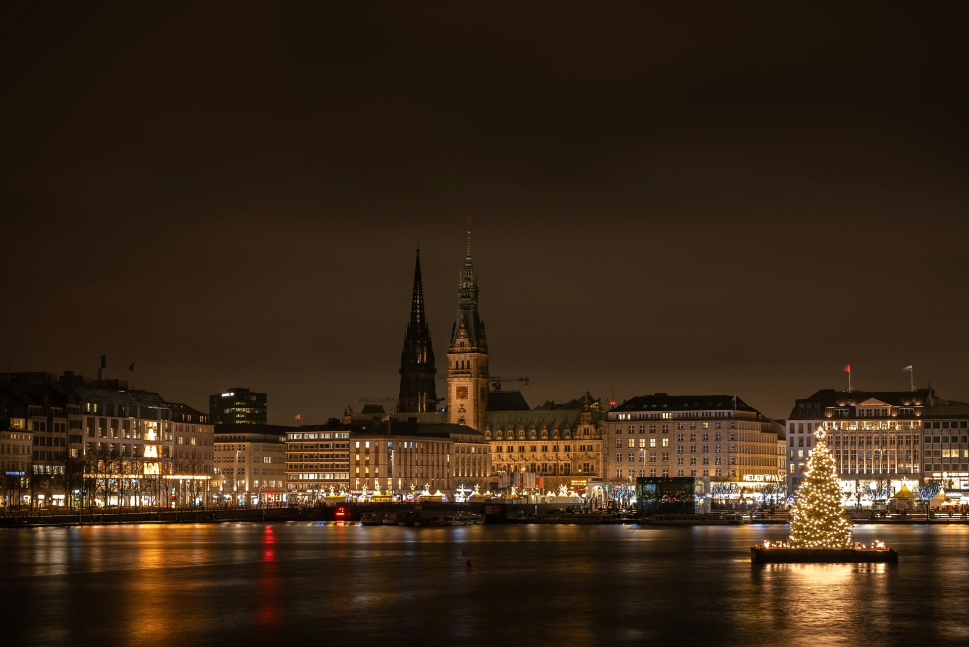 Binnenalster Lake at night with city lights reflecting on the water