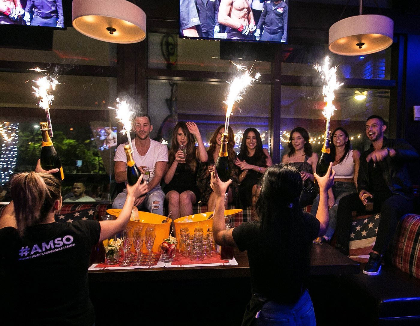 Lively crowd enjoying drinks and music at American Social Bar & Kitchen in Miami