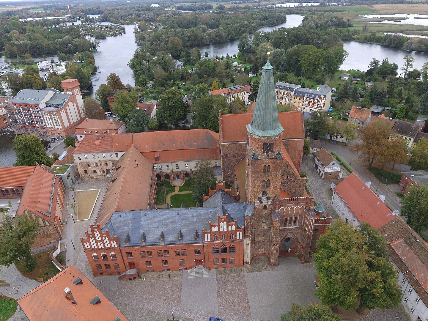 Aerial view of Brandenburg Cathedral surrounded by historic buildings and trees