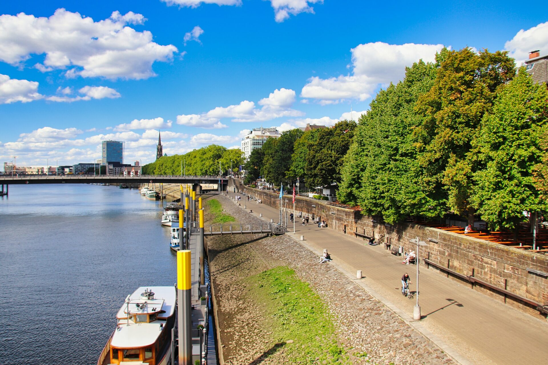 View of Bremen’s waterfront along the Weser River under a clear blue sky