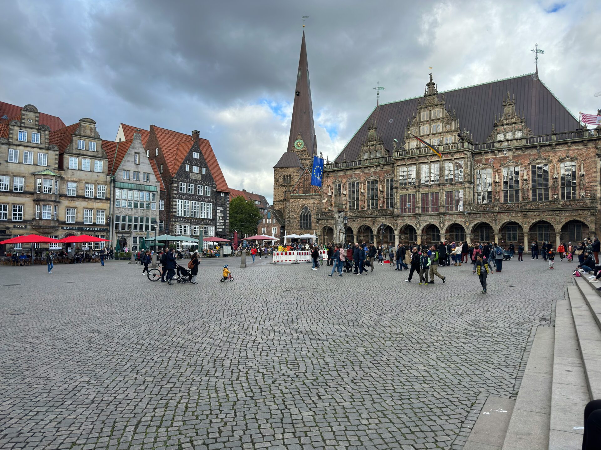 People walking across Bremen’s cobblestone market square