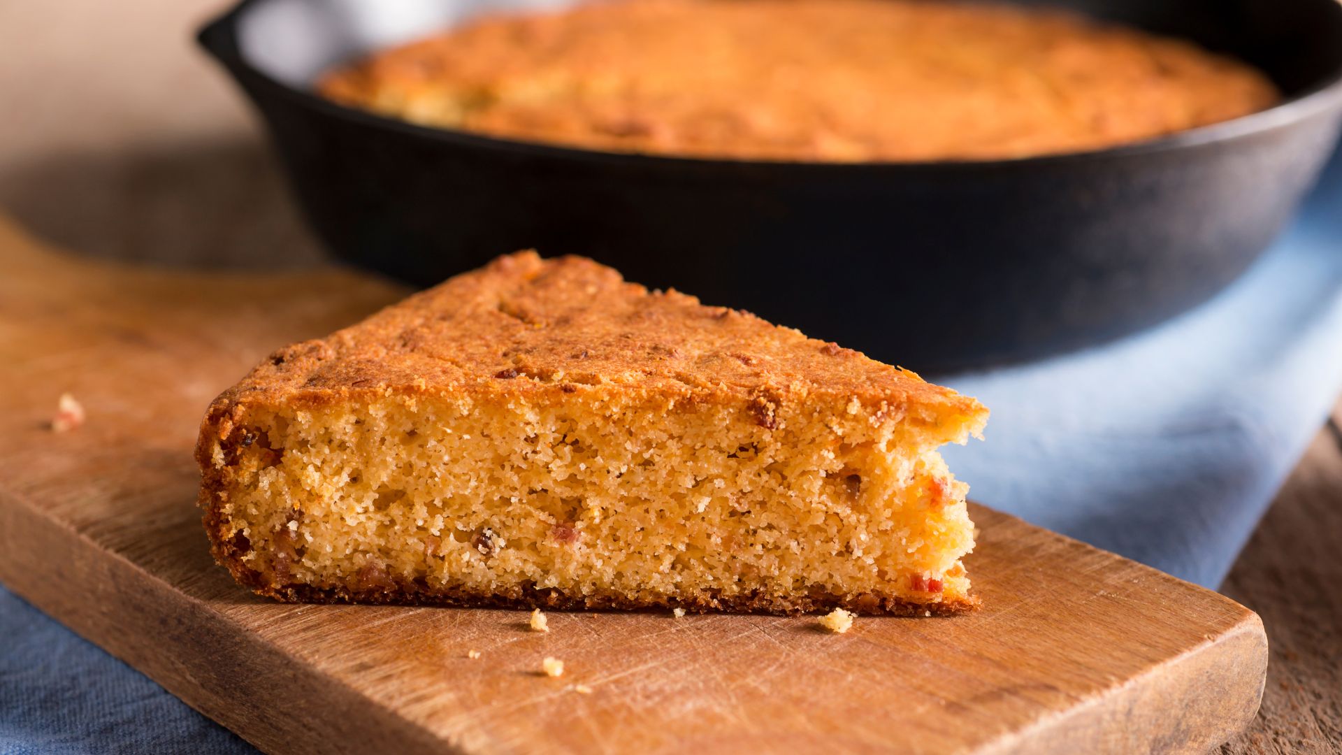 Golden hue and somewhat dense, coarse texture of Broa de Milho. 