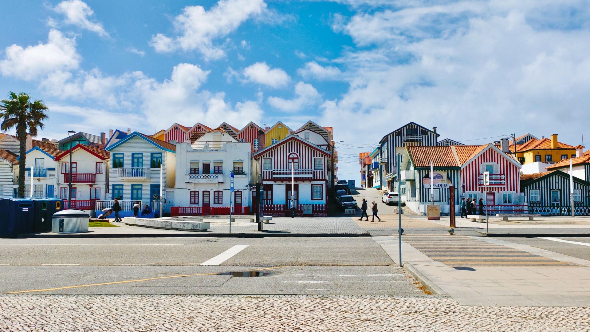 Iconic colorful striped houses (palheiros) of Costa Nova, a charming seaside village in Aveiro, Portugal.