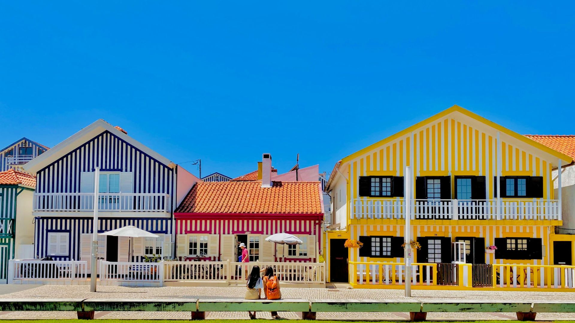 Iconic colorful striped houses (palheiros) of Costa Nova, a charming seaside village in Aveiro, Portugal.