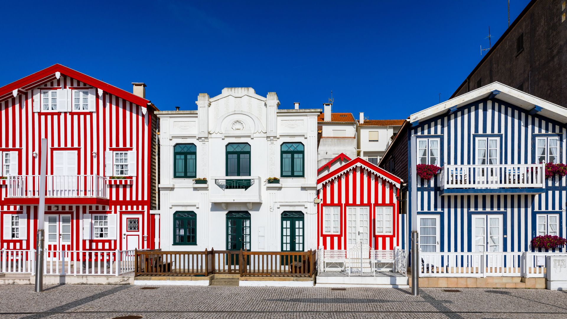 Iconic colorful striped houses (palheiros) of Costa Nova, a charming seaside village in Aveiro, Portugal.