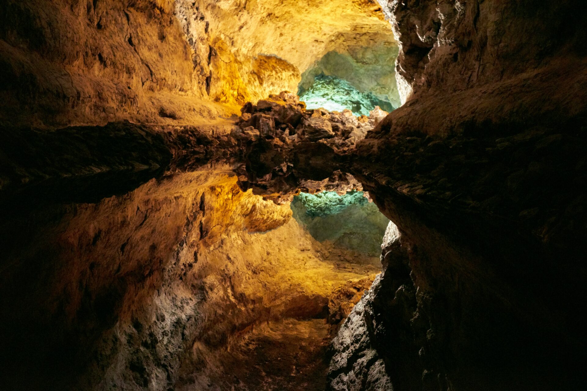Perfect reflection in still underground water at Cueva de los Verdes