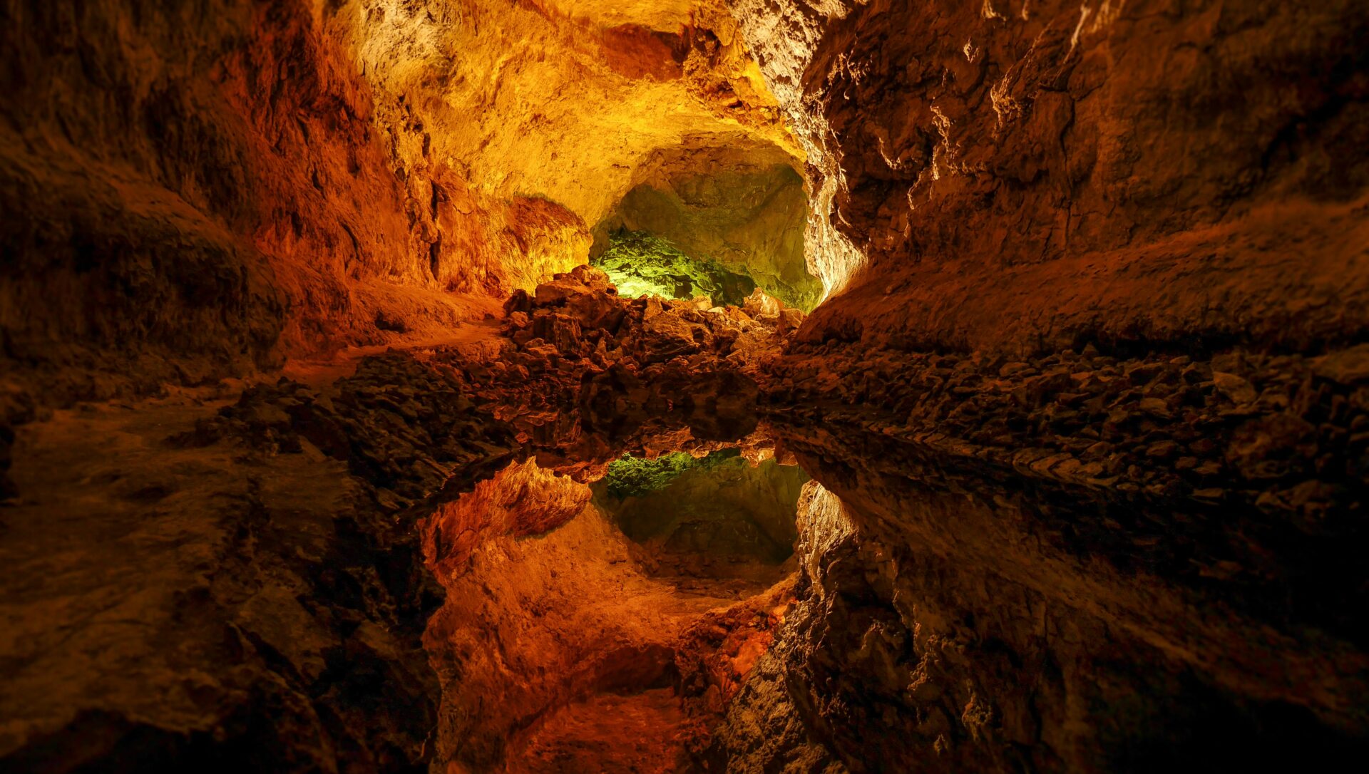 Illuminated passage inside Cueva de los Verdes
