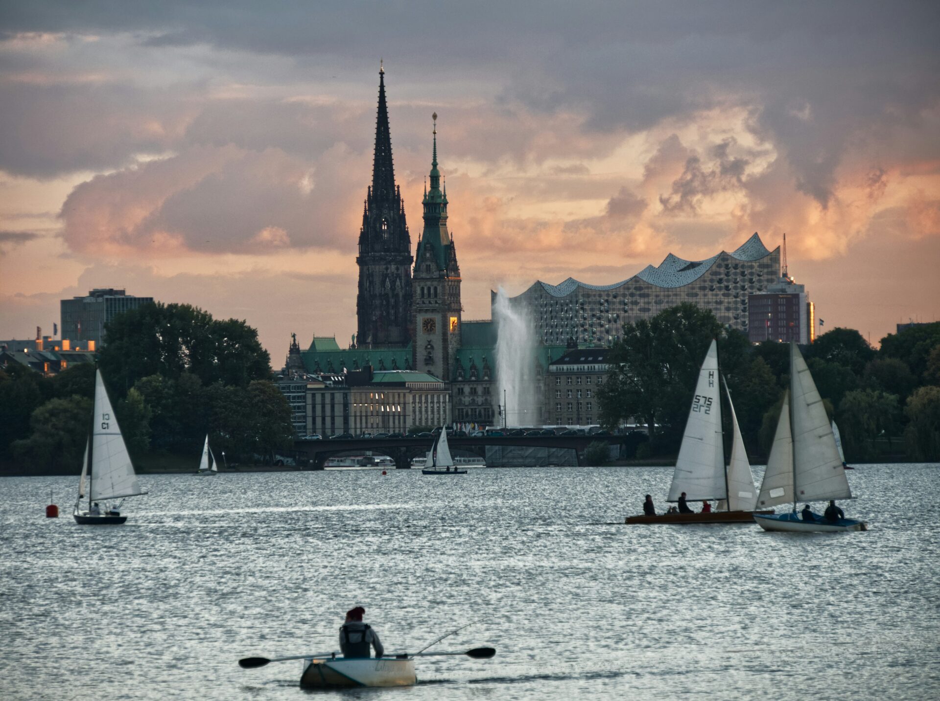 Boats gently glide across the wide expanse of the Elbe River