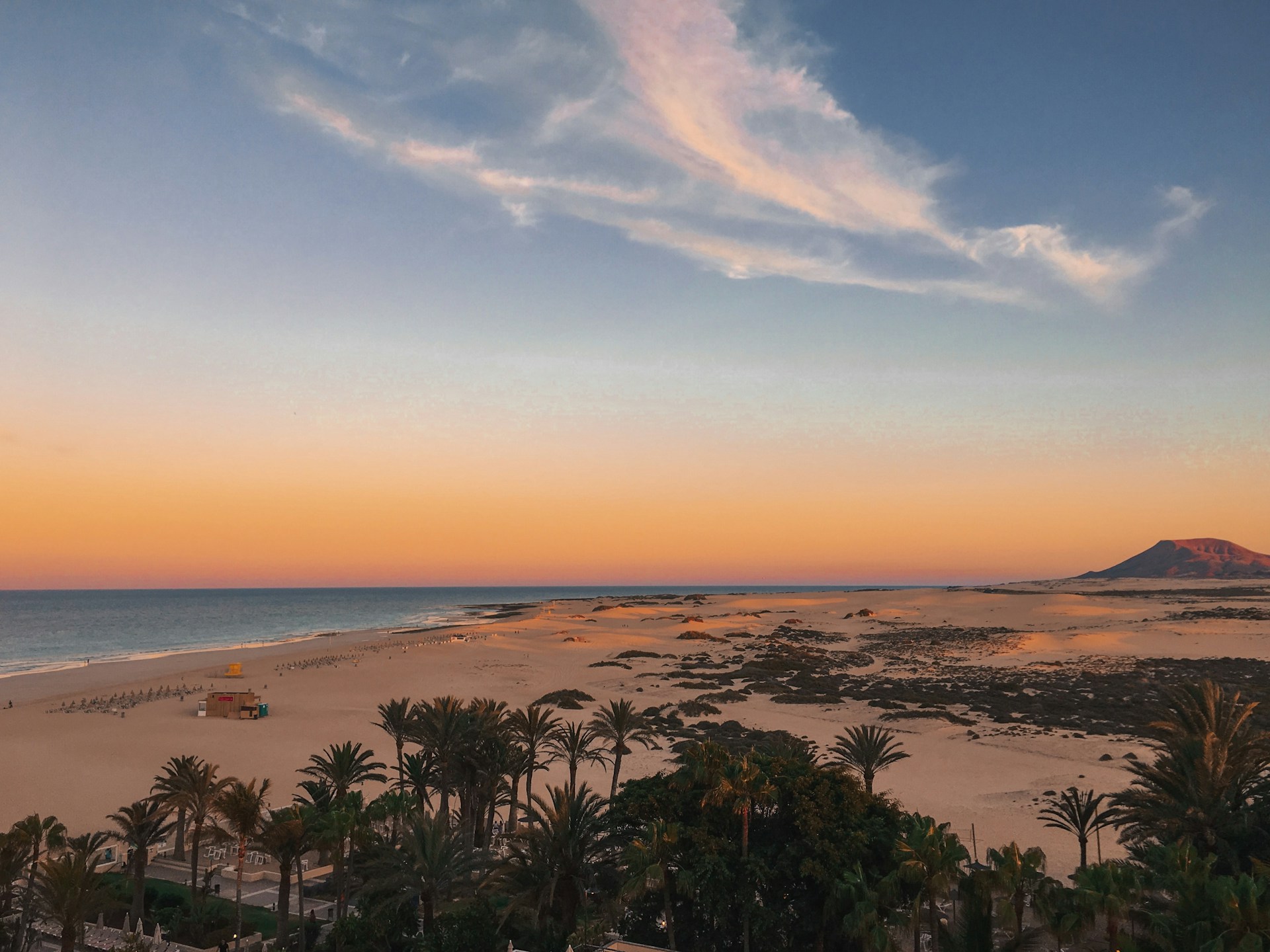 Golden sunset over a sandy beach in Fuerteventura