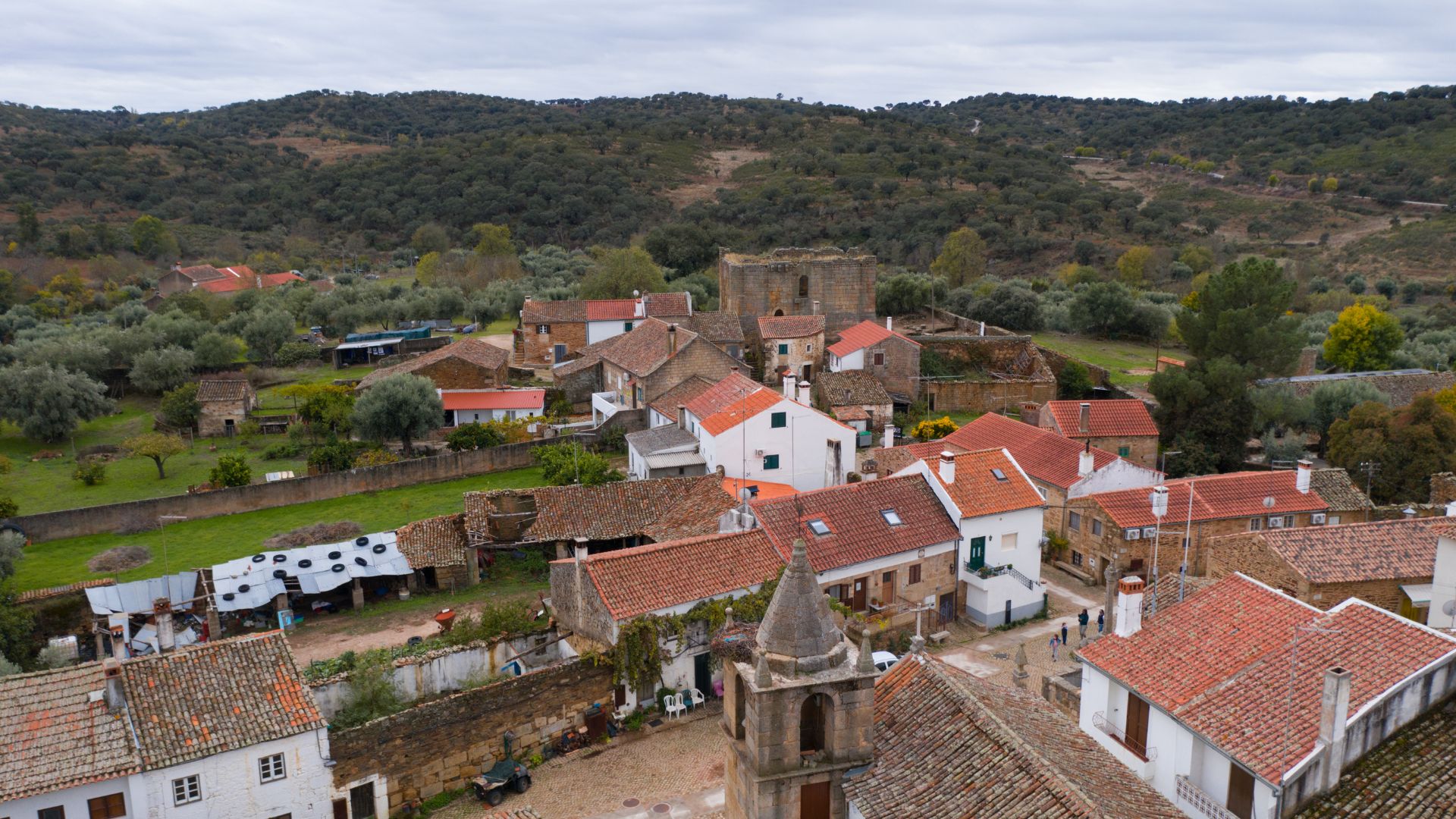 It is renowned as one of Portugal's oldest settlements and a significant archaeological site, featuring well-preserved ruins and antiquated stone buildings that reflect its Roman, Suevi, Visigothic, and Templar history. 