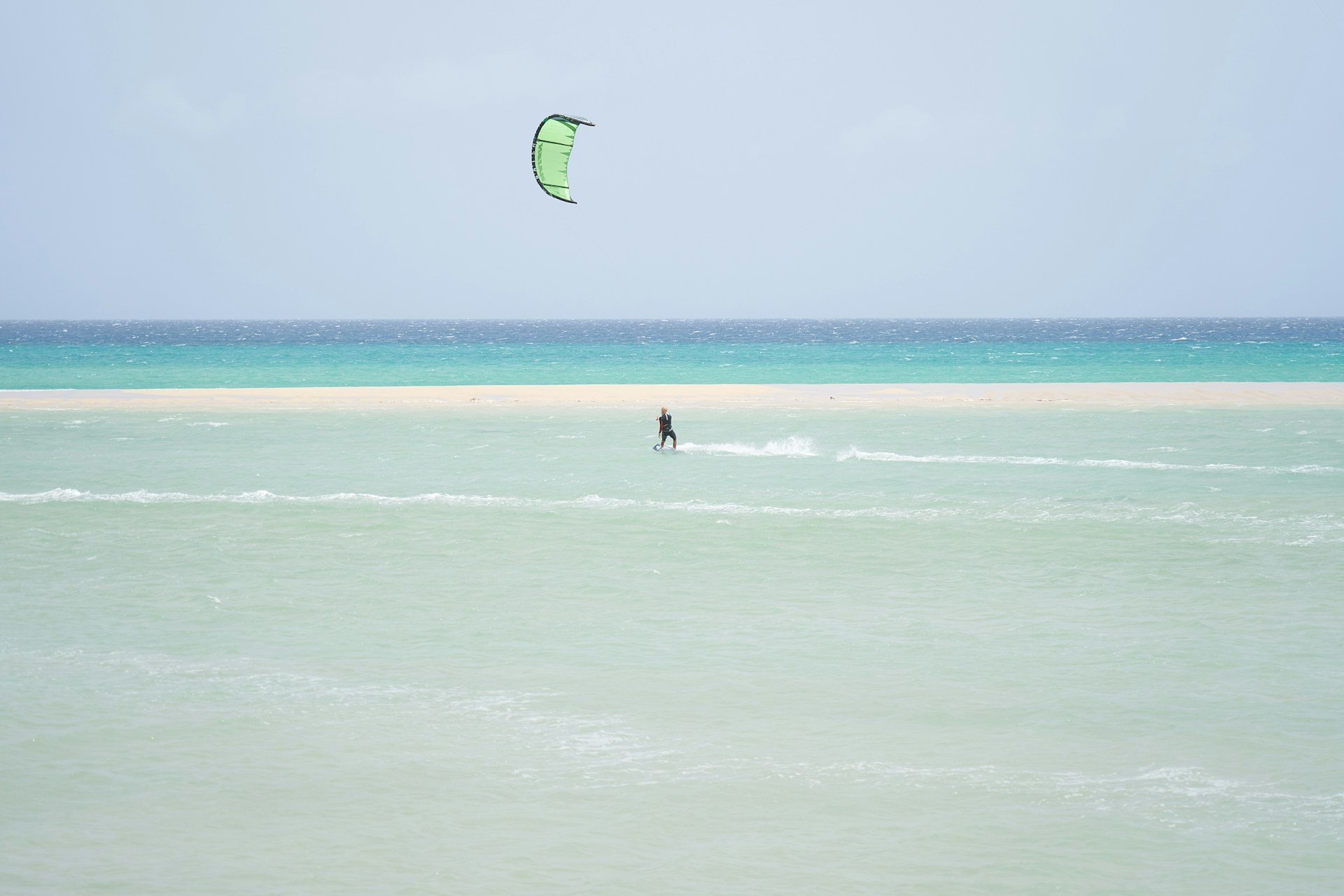 Kitesurfers gliding across the lagoon at Sotavento Beach
