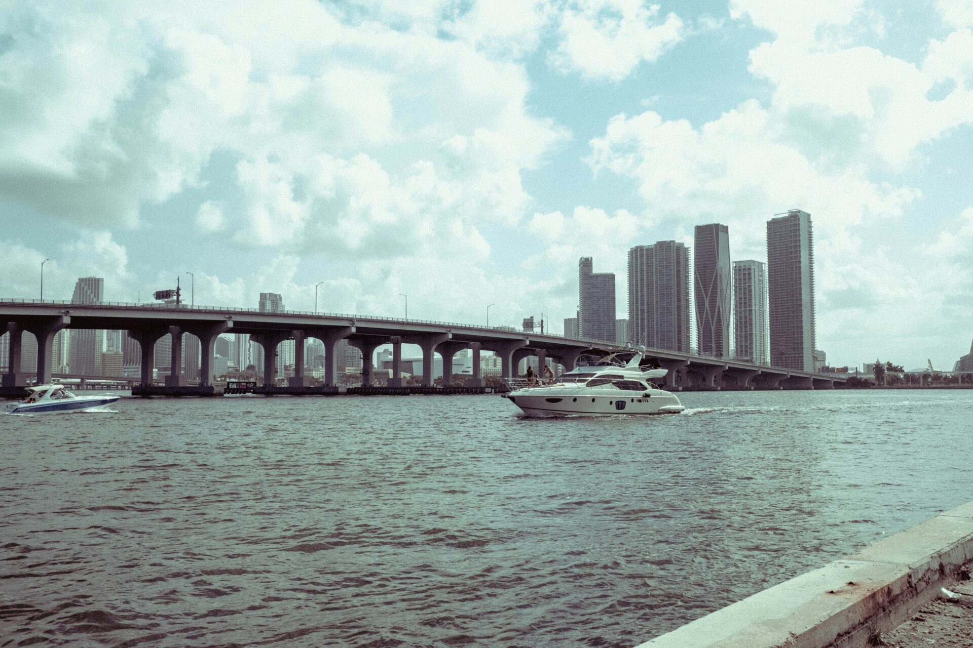 Scenic view of a boat in motion in front of Miami’s skyline