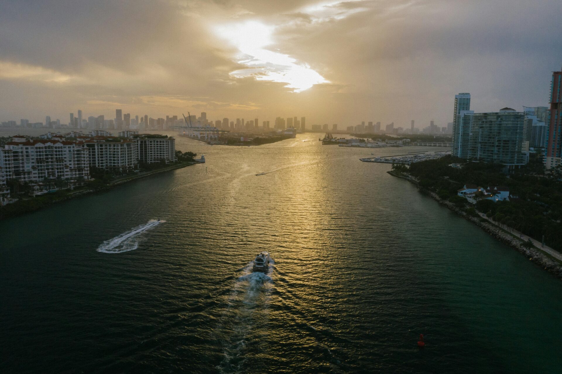 Leisure boat anchored near the coast with high-rise Miami buildings