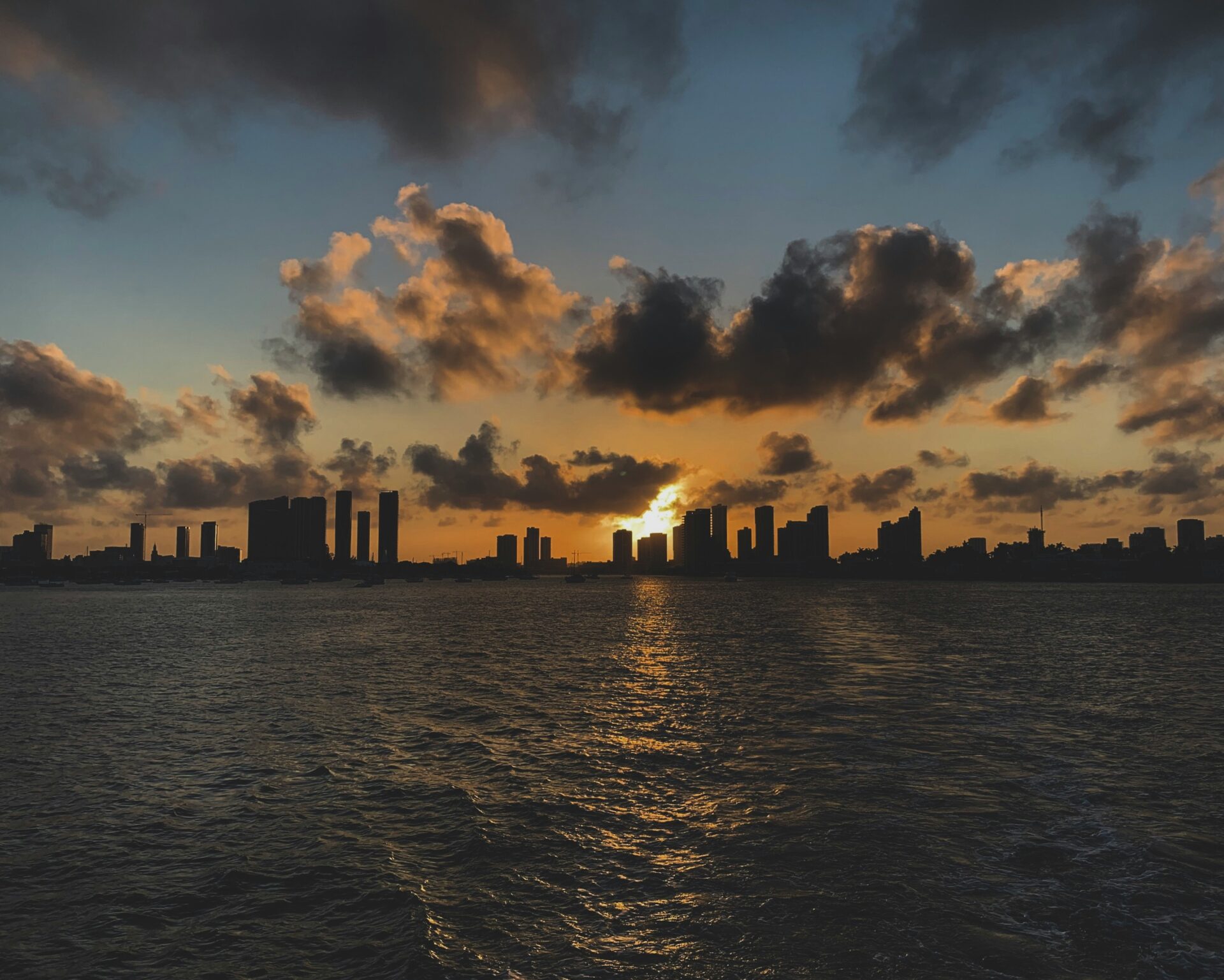 Miami skyline bathed in the soft glow of a vibrant sunrise