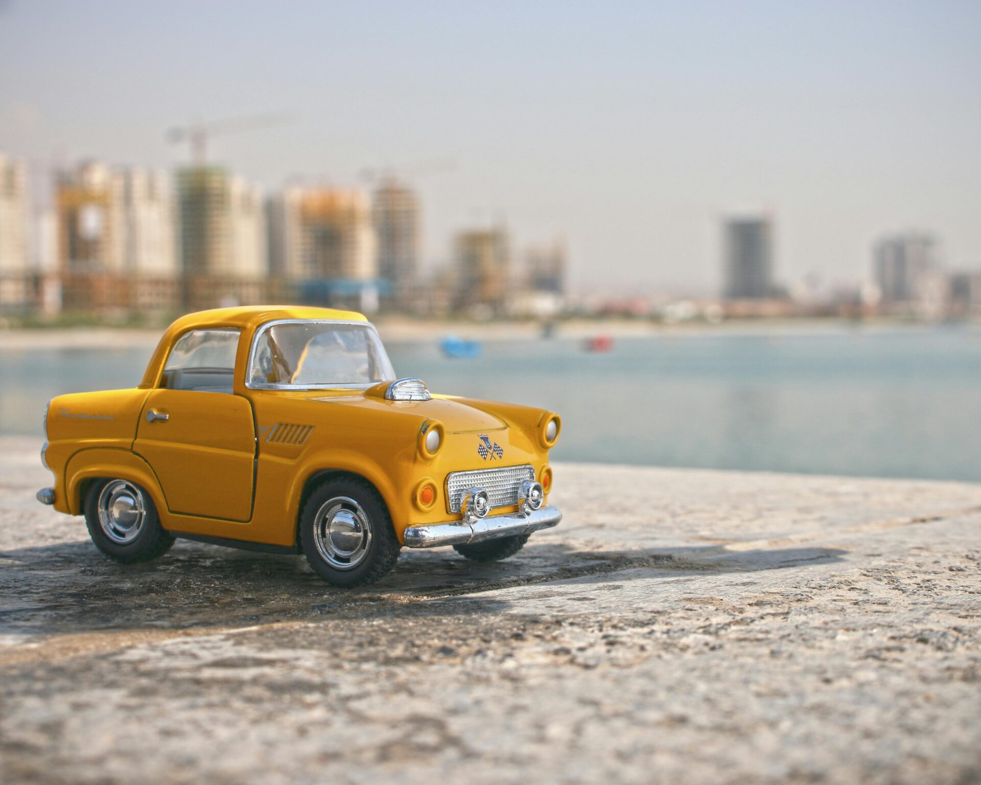A miniature car driving along a detailed road in Miniatur Wunderland