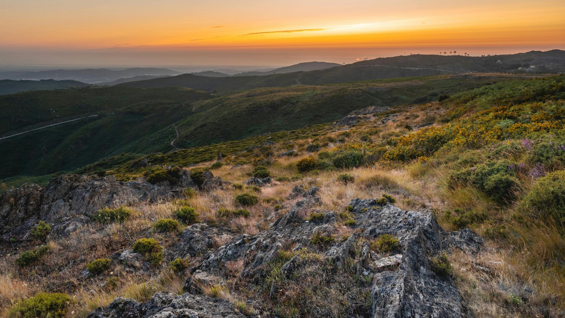 The image depicts the landscape of Serra da Estrela Natural Park, which is located in the Central Region of Portugal.
