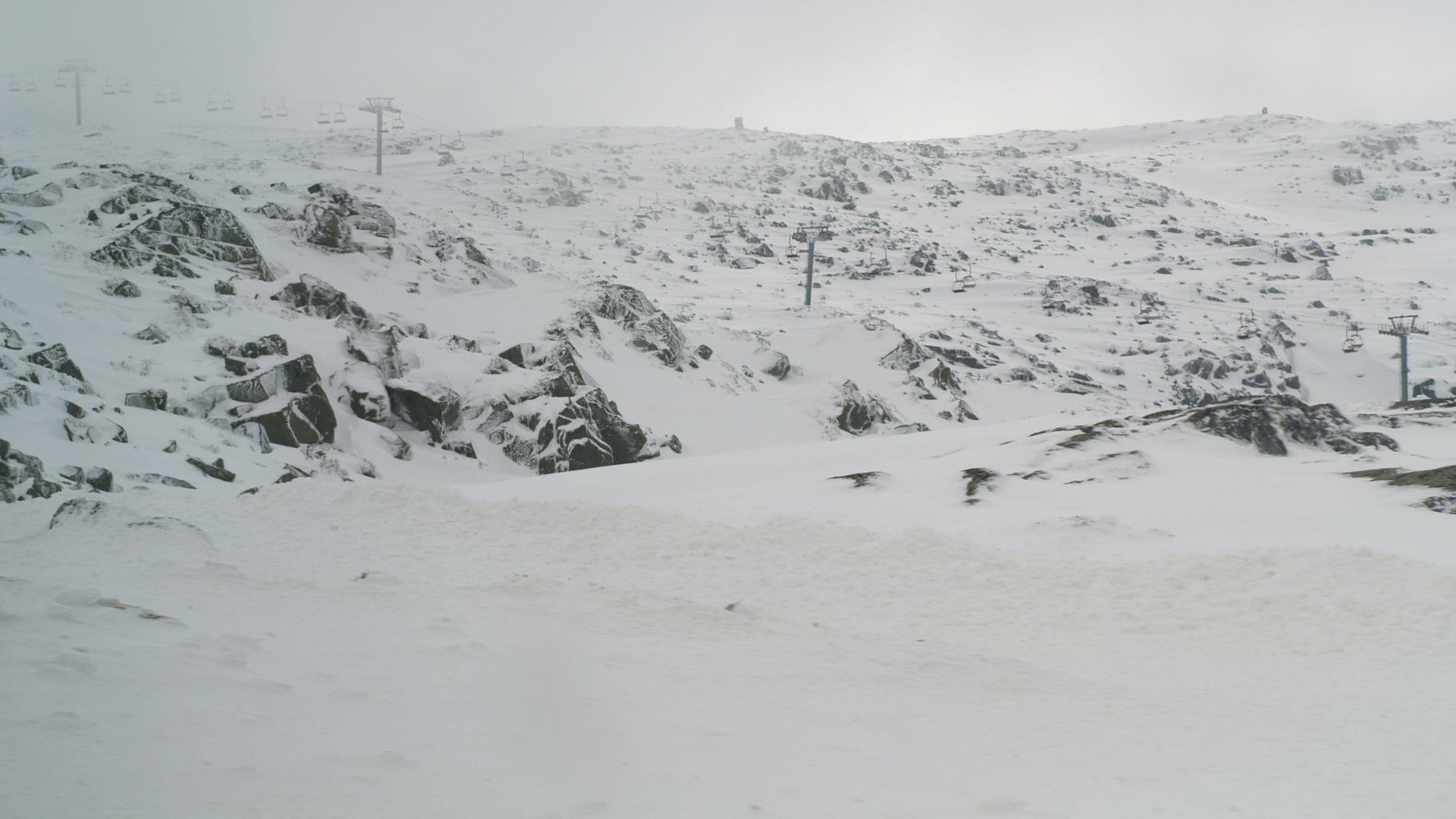 A serene winter landscape showcasing the majestic, snowy Serra da Estrela in Portugal 