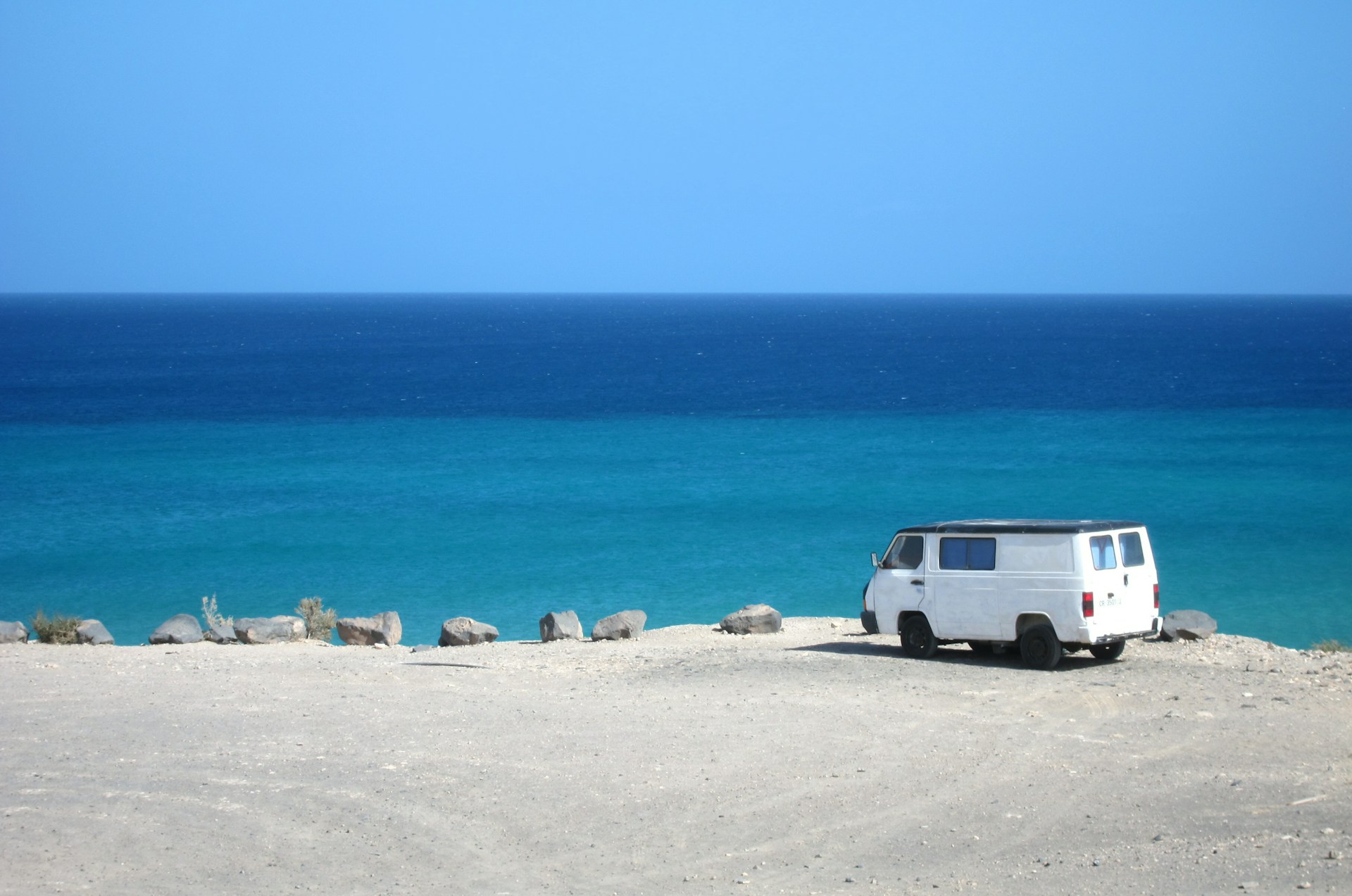 Wide view of Sotavento Beach with golden sand, shallow turquoise lagoons, and the Atlantic Ocean stretching into the distance