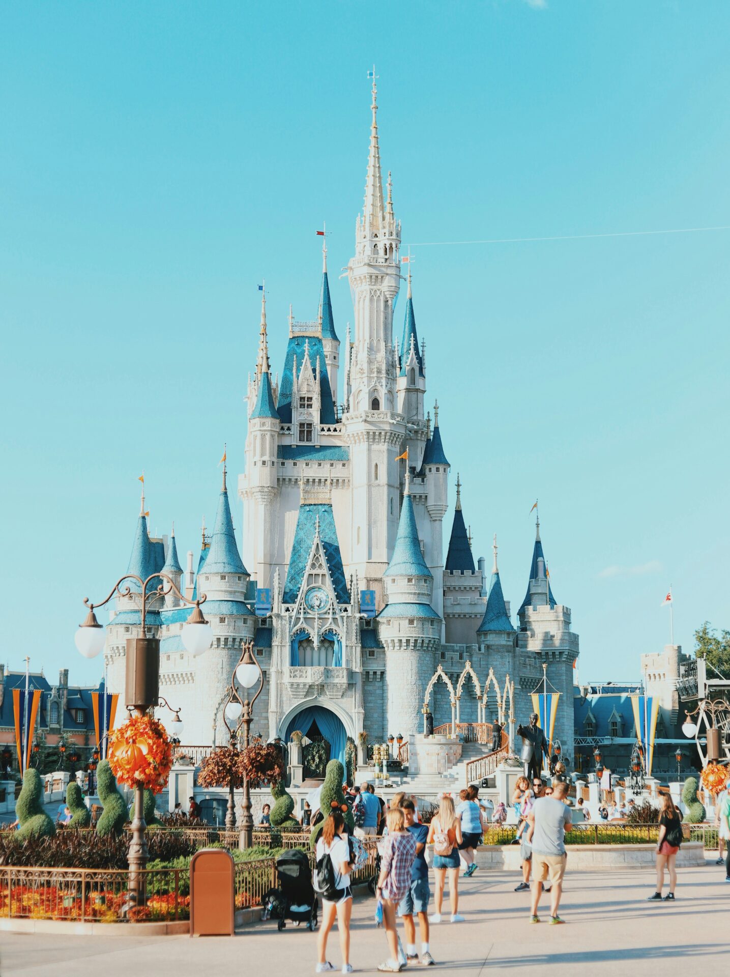 Crowds of families walking down Main Street, U.S.A., toward Cinderella Castle at Walt Disney World’s Magic Kingdom 